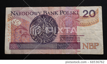 Twenty Polish zlotys on a dark background close Twenty Polish zlotys on a dark background close 68536762