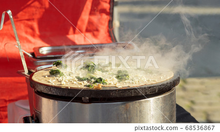 Farmers creperie - making pancakes at farmers street food market Farmers creperie - making pancakes at farmers street food market 68536867