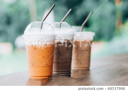 Closeup thai milk tea and chocolate on wood table 68537998