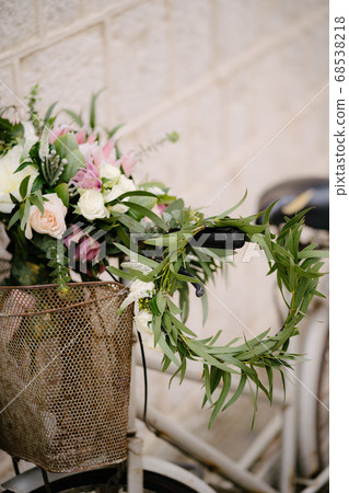 bridal bouquet of white and pink roses, protea, eucalypt tree branches, veronica and peonies on the bicycle and eucalyptus wreath on the wheel bridal bouquet of white and pink roses, protea, eucalypt tree branches, veronica and peonies on the bicycle and eucalyptus wreath on the wheel 68538218