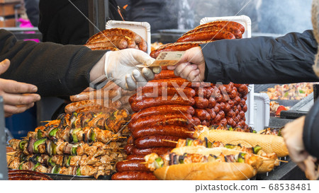 Buying street food at farmers street food market Buying street food at farmers street food market 68538481