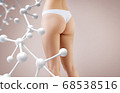 Woman with perfect buttocks near big molecule chain. 68538516