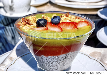 Chia pouding with fruits on a glass on a Chia pouding with fruits on a glass on a 68538518
