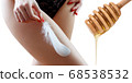 Perfect female hips near honey spoon over white background. 68538532