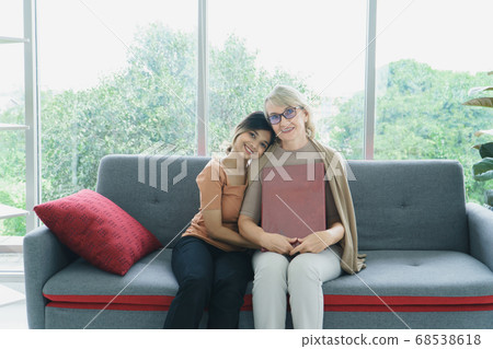 Granddaughter takes care of grandmother 68538618
