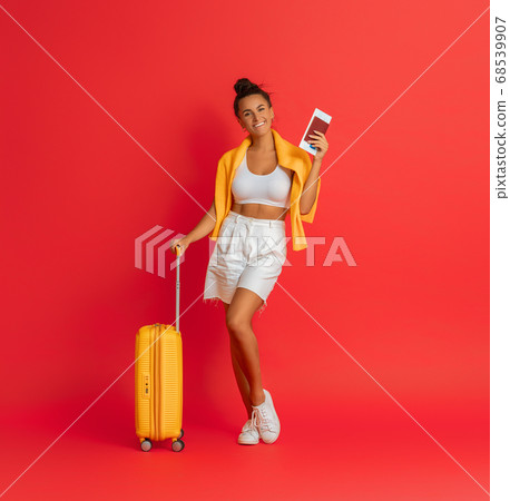 Happy woman going traveling 68539907