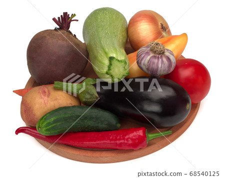 Colorful vegetables on a wooden board Colorful vegetables on a wooden board 68540125