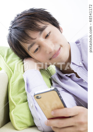 A man seeing a sleep with lying down A man seeing a sleep with lying down 68541172
