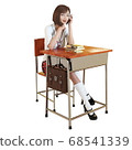 Ordinary schoolgirl in uniform sitting at school desk 68541339