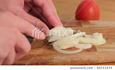 Chef slices onion. knife, cutting onion. Healthy 68541834