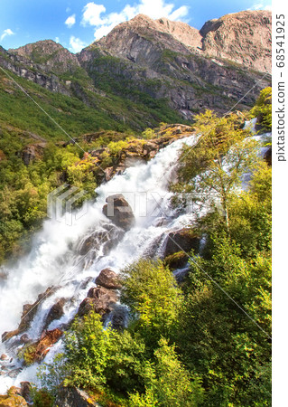 Rainbow and Briksdal waterfall in Norway Rainbow and Briksdal waterfall in Norway 68541925