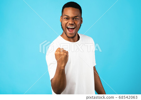 African Man Shaking Fist Gesturing Yes Celebrating Success, Studio Shot African Man Shaking Fist Gesturing Yes Celebrating Success, Studio Shot 68542063