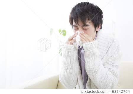 Male blowing nose Male blowing nose 68542764