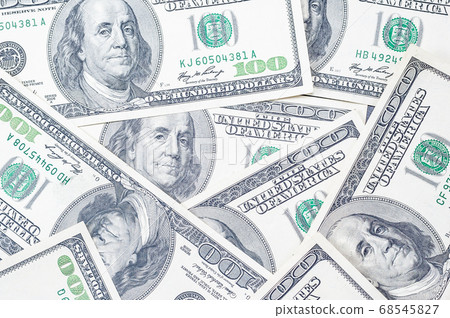 background of a many 100 dollars US bills with a background of a many 100 dollars US bills with a 68545827