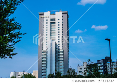 A view of Hosei University (super high-rise "Boissonade Tower") in the blue sky of Tokyo, Japan 68545832