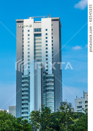 A view of Hosei University (super high-rise "Boissonade Tower") in the blue sky of Tokyo, Japan 68545835