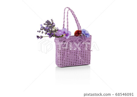 wicker bag with lavender flowers isolated on white 68546091