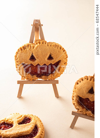 Halloween homemade gingerbread cookies over wooden table. Halloween holiday. Autumn concept. 68547444