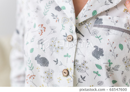 Warm kit homewear. Soft cotton cardigan. Comfortable clothes for healthy sleep. Pajamas concept. Close-up. 68547600