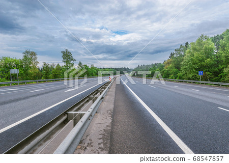 View of the new highway at cloudy summer morning. 68547857