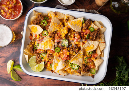nachos in white iron pan 68548197