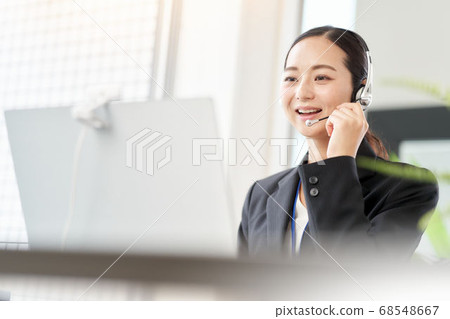 A woman making a video call to the PC A woman making a video call to the PC 68548667
