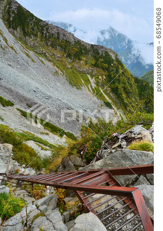 A rusted iron ladder that connects Kitahotakadake and Kusawa in the Northern Alps. Ladder. A difficult place. Distress. rescue. Difficult. Hotaka mountain range. 68549068