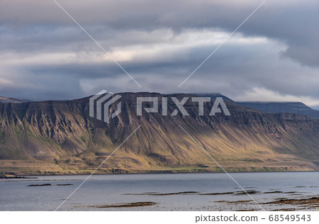 Landscape of westfjord with cloudy sky - Iceland. Landscape of westfjord with cloudy sky - Iceland. 68549543