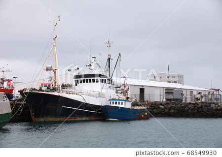 Trawlers are moored in port. Iceland 68549930