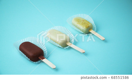 Ice cream on a stick on a blue background 68551586
