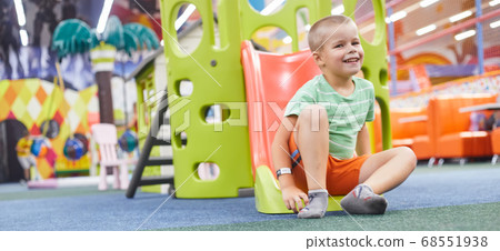 little Caucasian boy, cheerful, slid down the hill one little Caucasian boy, cheerful, slid down the hill one 68551938