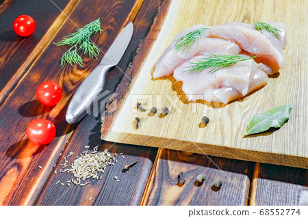 chicken fillet on a cutting Board top view chicken fillet on a cutting Board top view 68552774