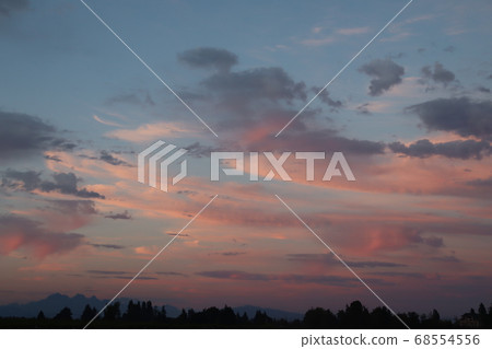Clouds reflected in the sunset 68554556