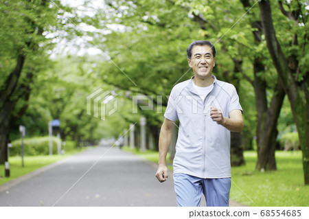 Senior man walking in the park 68554685