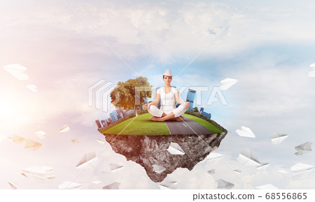 Young woman keeping mind conscious. Young woman keeping mind conscious. 68556865