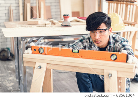 Carpenter Man is Working Timber Woodworking in Carpentry Workshops Carpenter Man is Working Timber Woodworking in Carpentry Workshops 68561304