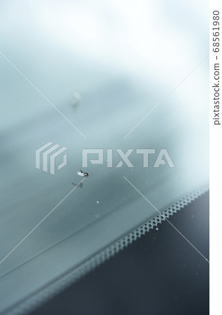 A scratch on the windshield of a car A scratch on the windshield of a car 68561980