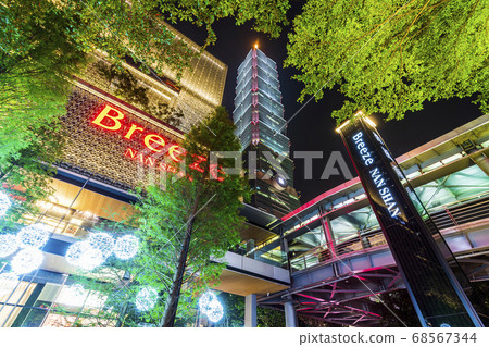 night view of the Xinyi District in Taipei, Taiwan. The district is a prime shopping area in Taipei, anchored by a number of department stores and malls. night view of the Xinyi District in Taipei, Taiwan. The district is a prime shopping area in Taipei, anchored by a number of department stores and malls. 68567344