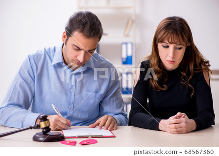 Young pair in courthouse in divorcing concept 68567360