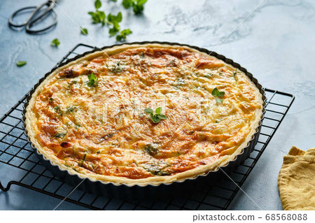 Quiche with ham and cheese. Open pie. 68568088