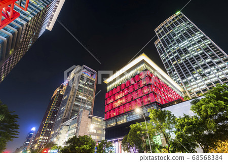 night view of the Xinyi District in Taipei, Taiwan. The district is a prime shopping area in Taipei, anchored by a number of department stores and malls. 68568384
