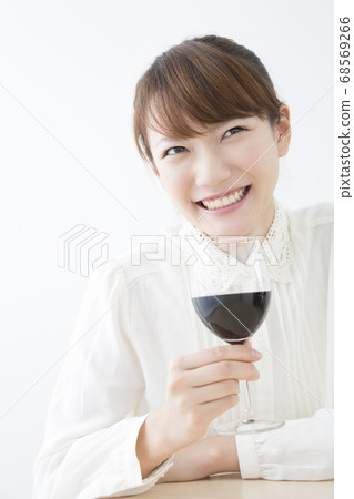 Woman drinking red wine Woman drinking red wine 68569266
