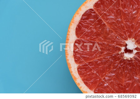 Fresh ruby grapefruit light blue background 68569392