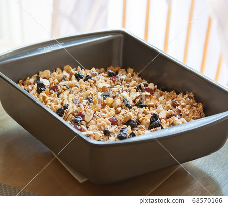 Fresh homemade granola in a baking pan 68570166
