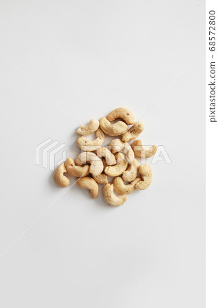 Cashew nut bowl on gray background design for poster, article or banner Cashew nut bowl on gray background design for poster, article or banner 68572800