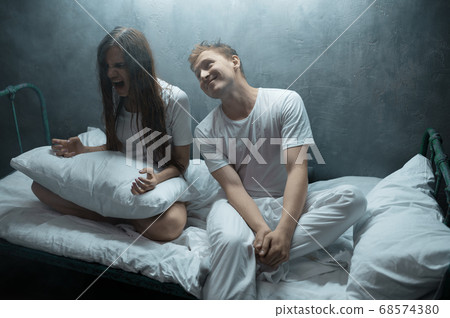Psycho man and woman are screams in bed, hospital 68574380