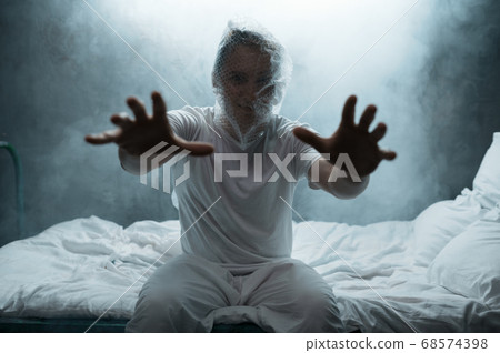 Crazy man held out his hands in bed, insomnia Crazy man held out his hands in bed, insomnia 68574398