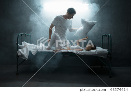 Psycho man strangles woman in bed, psychedelic 68574414