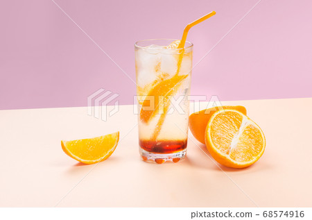 Orange alcohol cocktail with orange fruit slice on color background 68574916