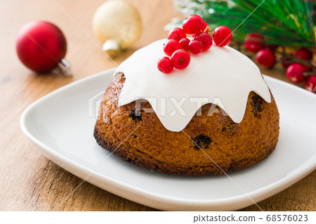Christmas pudding on wooden table Christmas pudding on wooden table 68576023